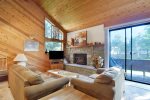 Mammoth Lakes Condo Rental Snowflower 82 - Living Room TV and Woodstove
